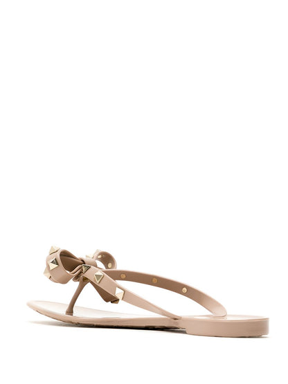 Valentino Garavani Rockstud Rubber Flip Flops in Powder Pink with Bow and Studs Powder